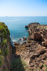 Fototapeta na wymiar The rocky coastline of Cascais near Lisbon in Portugal.