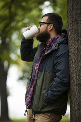 Man With Beard And Glasses Drinking Coffee Tea To Go Cup