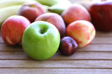Juicy fruits on wooden table, close-up