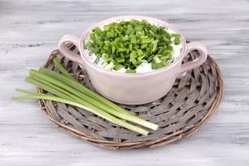 Pink round pan of cream with onion