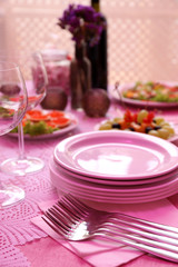 Buffet table with dishware waiting for guests