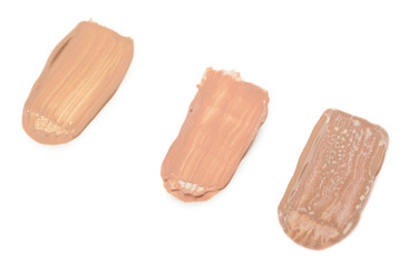 Different liquid foundation isolated on white