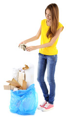 Young girl sorting paper and cardboard isolated on white