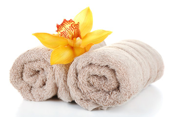Obraz na płótnie Canvas Orchid flower and towels isolated on white