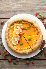 Homemade pumpkin pie on table
