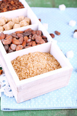 Wooden box with set of coffee and cocoa beans, sugar cubes