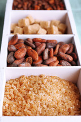 Wooden box with set of coffee and cocoa beans, sugar cubes