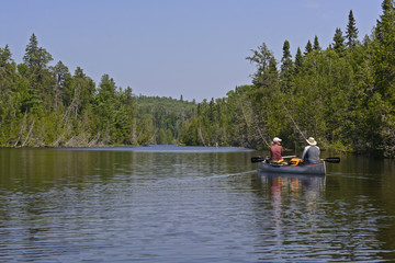 Canoers Heading into a North Woods lake