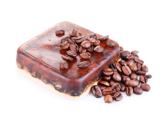 Organic soap with coffee beans, isolated on white