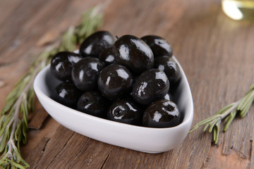 Marinated olives on table close-up