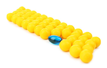 Individuality concept. Pills isolated on white