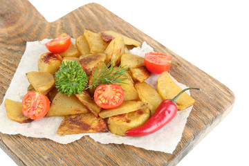Homemade fried potato on wooden cutting board isolated on white