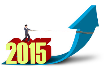 Businesswoman draws upward arrow