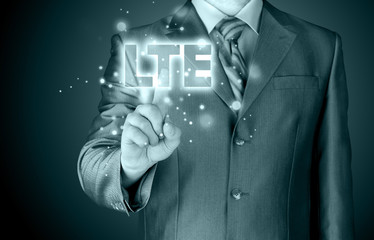 businessman is pushing his finger on lte button