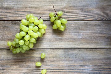bunch green grapes on wooden background