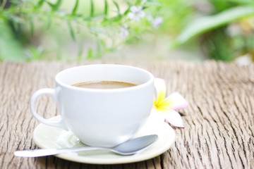coffee in white cup on wooden table