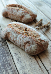 Homemade bread rolls on a wooden table