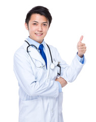 Young doctor with finger thumb up