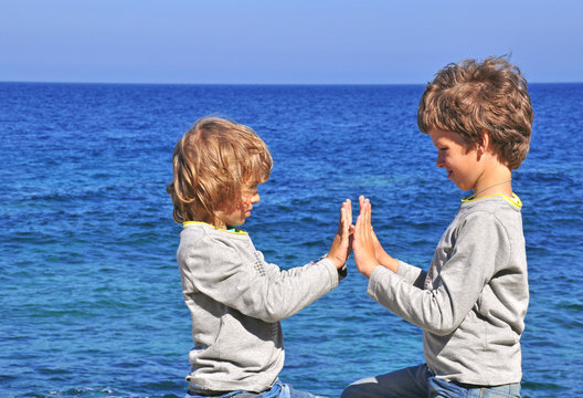 Two boys at the sea