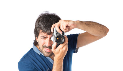 Man photographing over white background