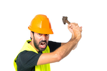 workman with wrench over white background