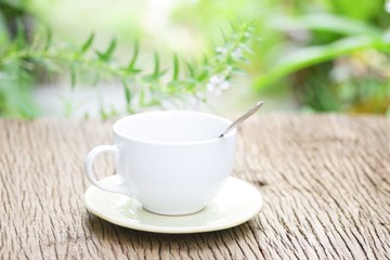 coffee in white cup on wooden table
