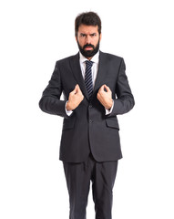 Businessman doing surprise gesture over white background