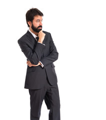 Businessman thinking over isolated white background