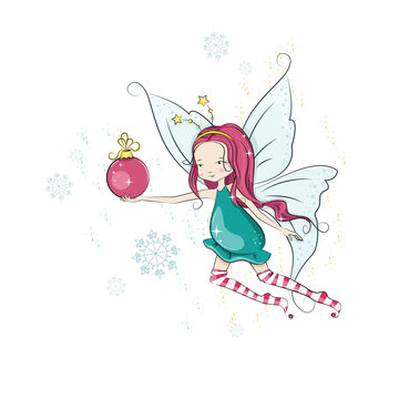 Cute Christmas flying fairy and her hand bright Christmas ball.
