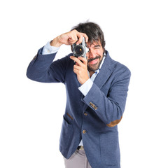 Fototapeta premium Man photographing over white background