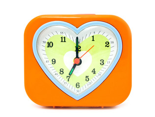alarm clock with a heart on a white background