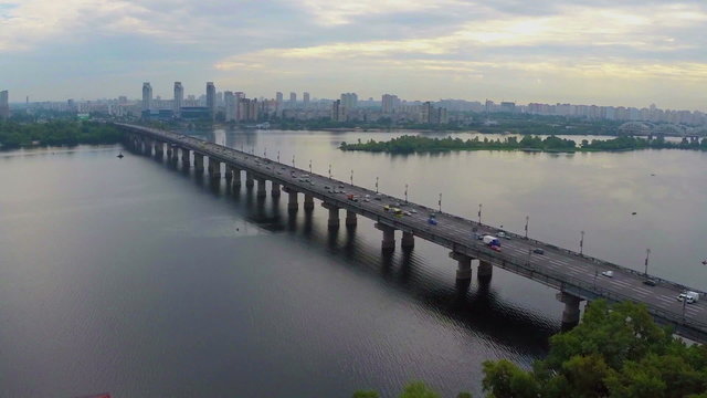Car traffic driving busy river bridge, rush hour, aerial view