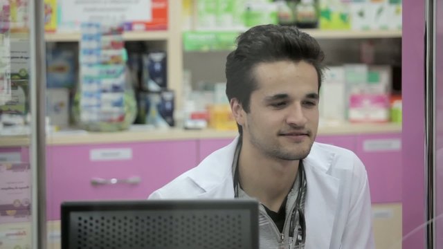 Pharmacist smiling to client