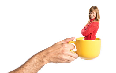 Girl inside cup of coffee