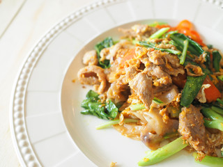 Pad See Ew, Stir fried flat noodle and pork with preserved soy b