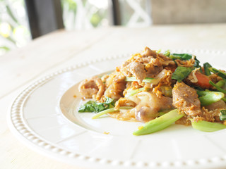 Pad See Ew, Stir fried flat noodle and pork with preserved soy b