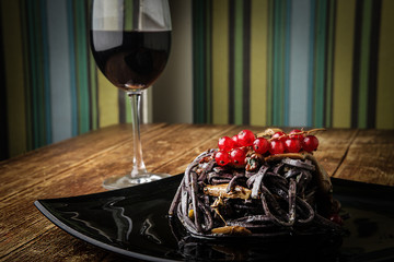 A tasty pasta and a glass of wine