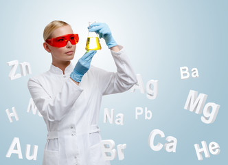 Woman doctor making chemical combination in Erlenmeyer flask