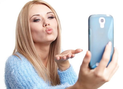 a beautiful blonde  girl taking selfie