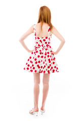 model isolated on plain background back hands on hips