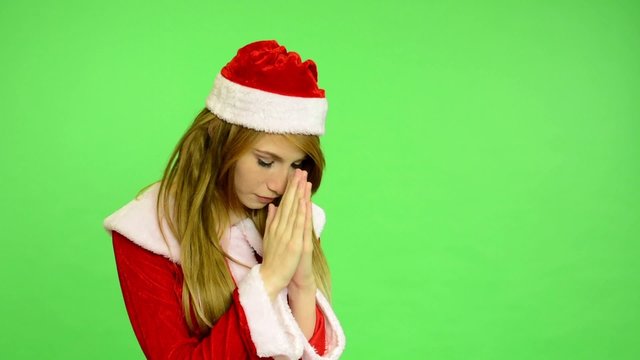 Christmas - Holidays - green screen - woman prays