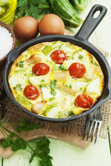 Zucchini baked with chicken, cherry tomatoes and herbs