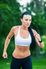 Fototapeta premium Young woman jogging in nature