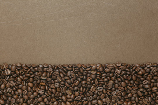 Caffe edition, coffee beans on old brown paper