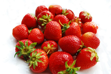 Ripe strawberries on a white background