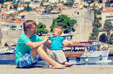 Fototapeta na wymiar father and little daughter on vacation in Europe