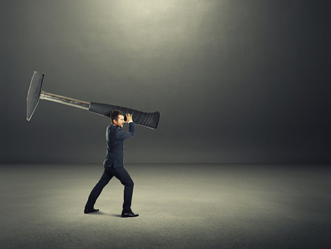 Man Holding Big Hammer And Hitting