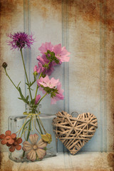 Beautiful flower in vase with heart still life love concept