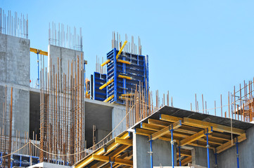 Fototapeta na wymiar Building construction site work against blue sky