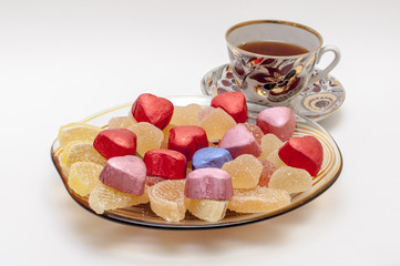 sweets on a plate with tea